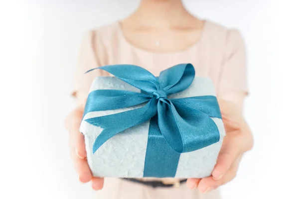 Woman Holding Gift Box Blue Ribbon Stock Photo