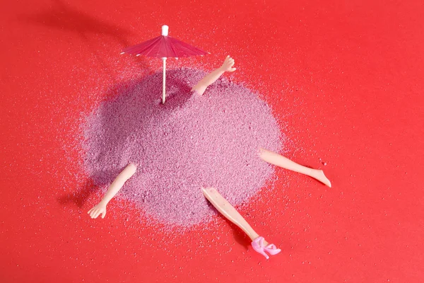 Doll and pink sand — Stock Photo, Image