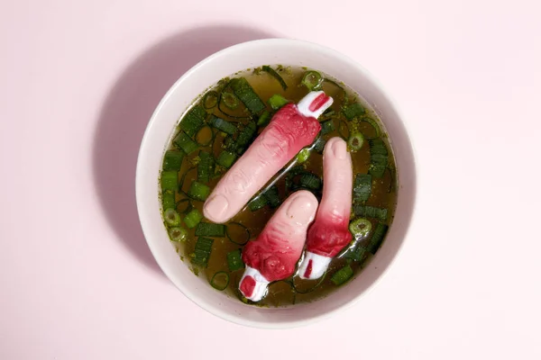 Palce zupa różowe tło — Zdjęcie stockowe