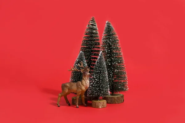 Forest firs and reindeer red — Stock Photo, Image