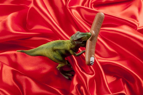 Dinosaure eating sausage manicure — Stock Photo, Image