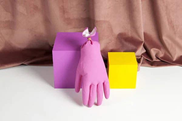 Colourful velvet pink plastic glove cube — Stock Photo, Image