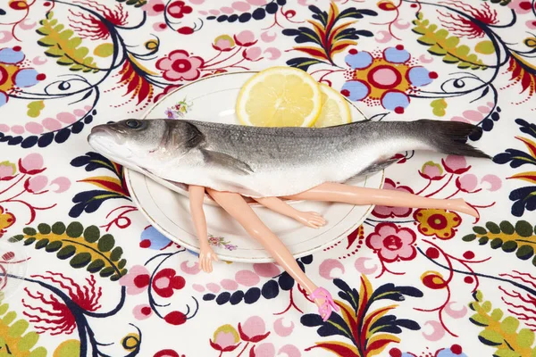 Fish flower plate cannibal doll — Stock Photo, Image