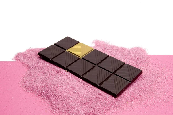 Lucky Gold choklad rosa bakgrund — Stockfoto