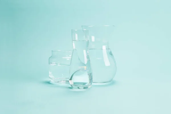 transparent glass vases filled with clear water