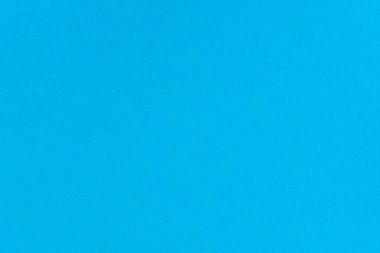 Mavi renkli kağıt arka plan. Tek renkli karton üzerinde boş alan.