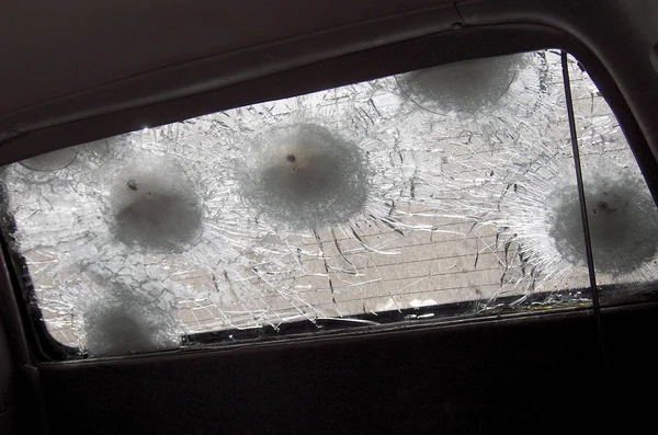 Big crack to windshield of car from fragment military sniper bul — Stock Photo, Image