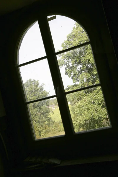 Beautiful wooden frame window in old building without people