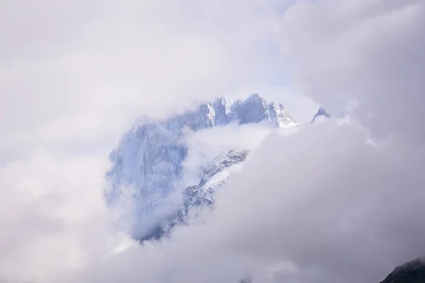 The top of the Alps Mont Blanc. Mountains in the clouds in the fog. Climate problems warming and lack of snow. — Stock Image Top Alps Mont Blanc Mountains Clouds Fog Climate Problems Warming Royalty Free Stock Photos