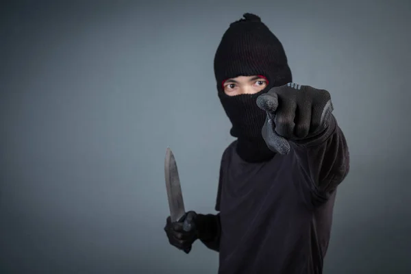 Criminals Wear Black Mask Hold Dark Gray Background — стоковое фото