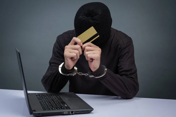 Thief Wearing Black Hat Obscuring Face Arrested Gray Background — Fotografia de Stock