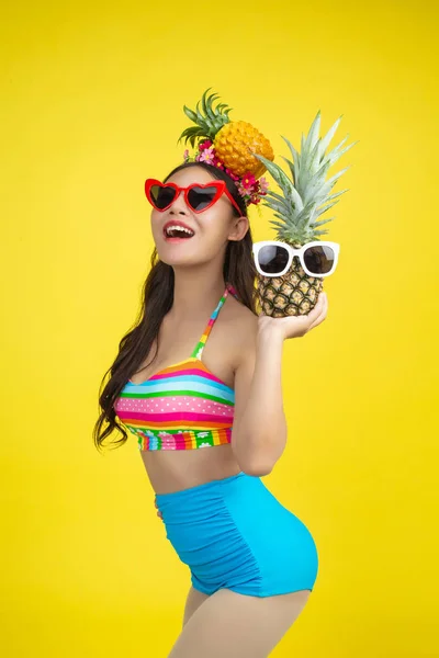 Beautiful Woman Swimsuit Holding Pineapple Poses Yellow Background — Stockfoto