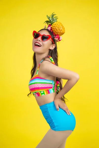Beautiful Woman Swimsuit Holding Pineapple Poses Yellow Background — Stockfoto