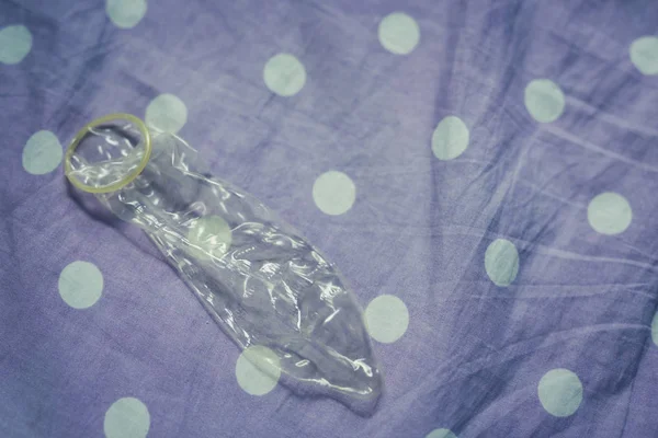 Condoms Have Been Used Placed Wrinkled Fabrics — Stockfoto