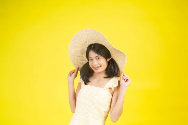 Beautiful Happy Woman Wearing Big Hat Showing Cheerfulness Yellow Background — Fotografia de Stock