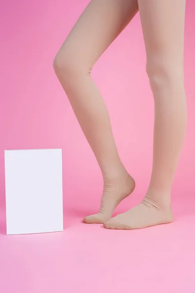 Slender Legs Beautiful Woman Wearing Stockings Box Pink Background — Zdjęcie stockowe