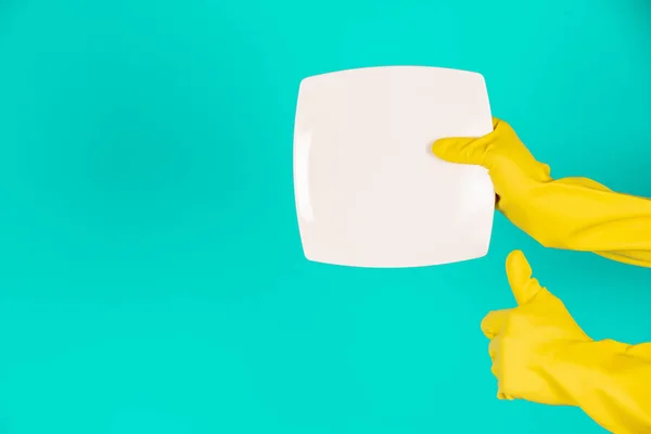 Concept Dishwasher Wearing Yellow Gloves Blue Background — Stock Photo, Image