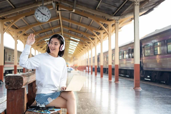 Women Listening Music Playing Notebooks While Waiting Train Tourism Concept — ストック写真