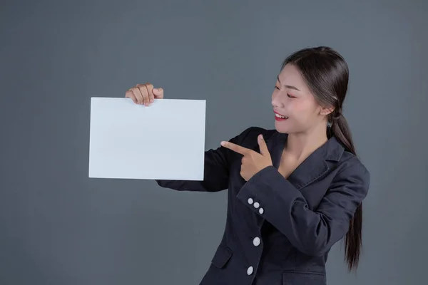 Office Girl Holding White Blank Board Gray Background — ストック写真