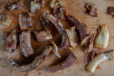 Roast pork on a wooden chopping board.