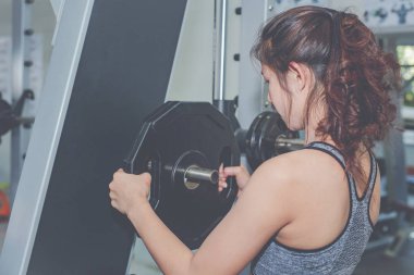 Girl playing fitness in the gym.