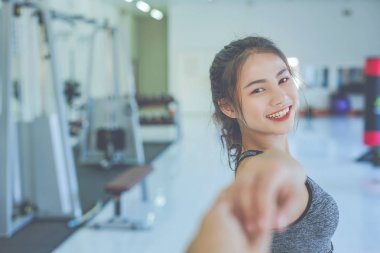 Girl playing fitness in the gym.