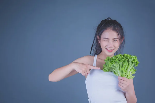 Girl Holds Vegetables Gray Background — 图库照片