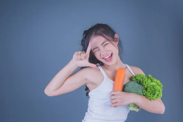 Girl Holds Vegetables Gray Background — Foto de Stock