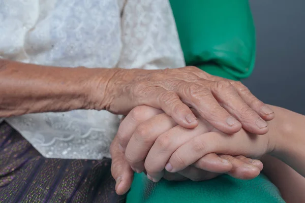 Young Woman Holding Elderly Woman Hand — Fotografia de Stock