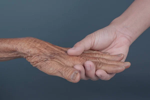 Young Woman Holding Elderly Woman Hand — Fotografia de Stock