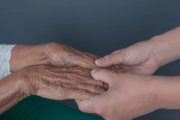 Young Woman Holding Elderly Woman Hand — Fotografia de Stock
