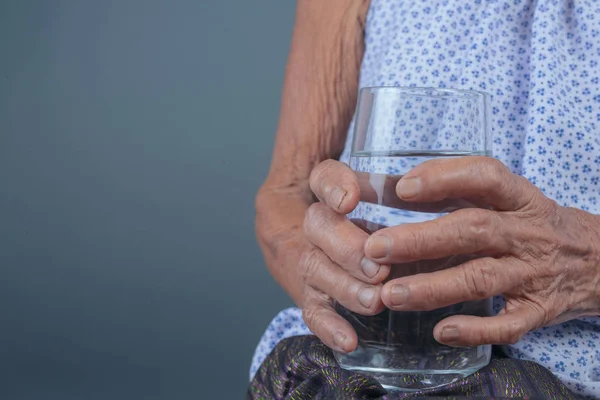 Old Woman Drank Water Gray Background — Fotografia de Stock