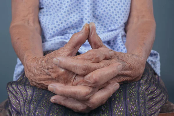 Senior Woman Clasping Hands Gray Background — Fotografia de Stock