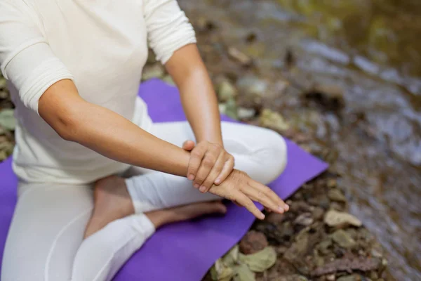 Mosquito repellent. Women are using insect repellent cream in the forest.