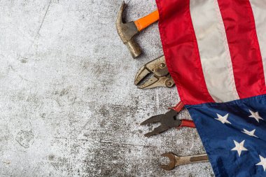 American flag and tools near the helmet Labor day concept.
