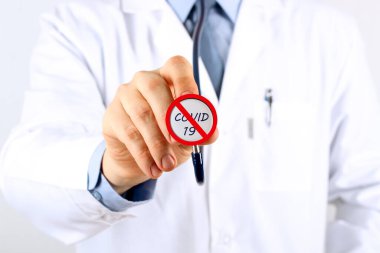Doctor holding stethoscope with covid 19. Stop Coronavirus