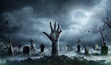 Zombie Hand Rising Out Of A Graveyard In Spooky Night clipart