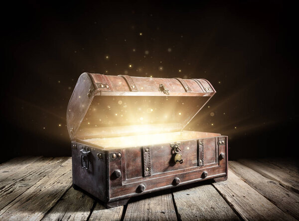 Treasure Chest - Open Ancient Trunk with Glowing Magic Lights In The Dark
