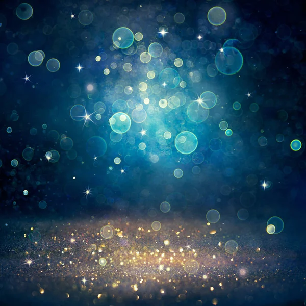 Christmas Defocused Golden Glitter Dust Blue Background — Stock Photo, Image