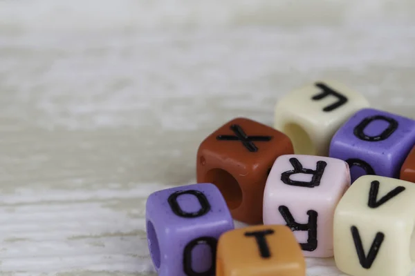 Small Colorful Plastic Beads Letters — Stock Photo, Image