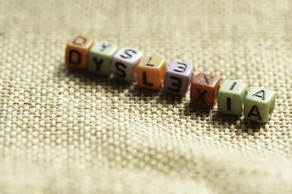 Dyslexia Wording Alphabet Beads Sacks Selective Focus — Stock Photo, Image