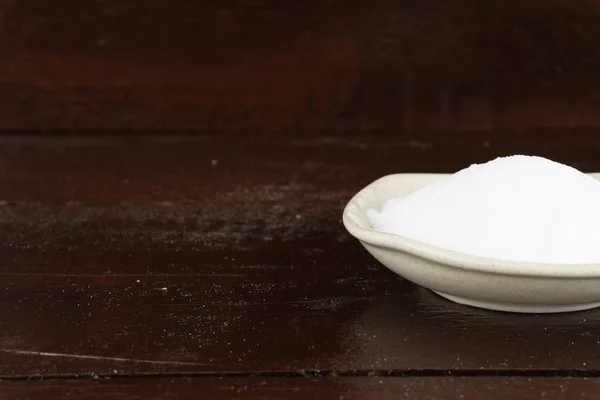 heap of white soda in white bowl plate