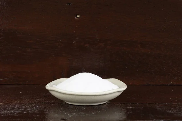 heap of white soda in white bowl plate