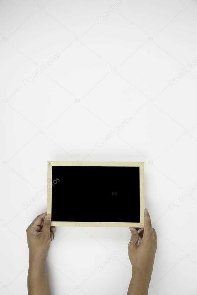 hands holding black board over white background