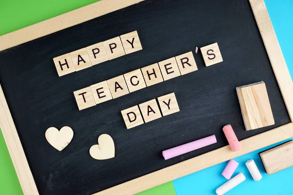 Happy Teachers Day wording on a black board