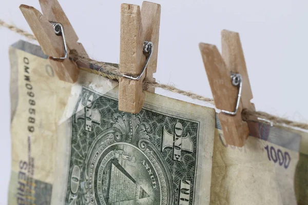 Money Laundry concept, hanging paper money on clothesline