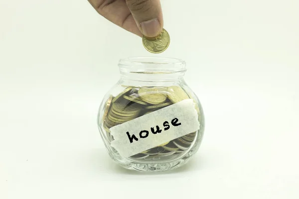 saving money coins in jar for house