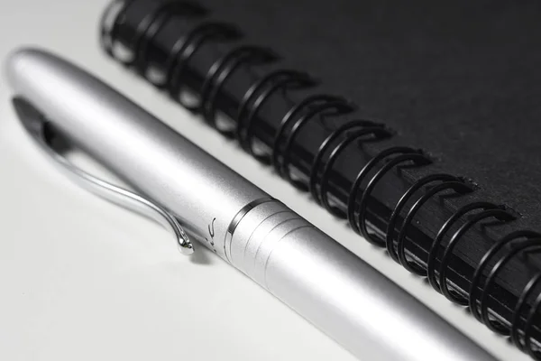 Low Key Lighting Black Book Silver Pen — Stock Photo, Image