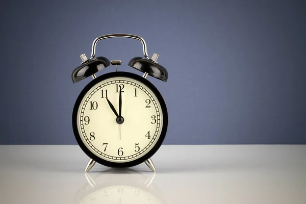 old-fashioned Alarm clock in studio, time concept
