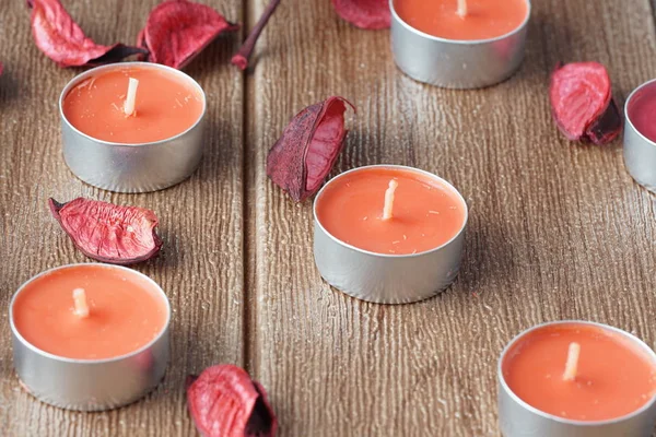 paraffin Tealight Candles and dry petals